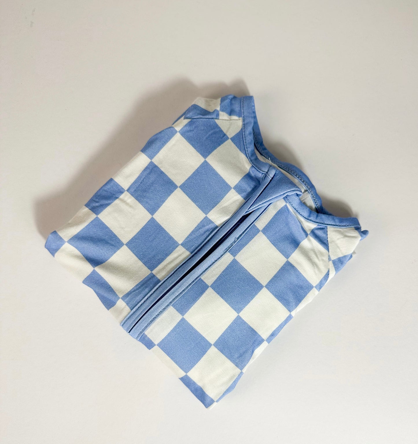 Tiny Cubs blue checkered romper folded